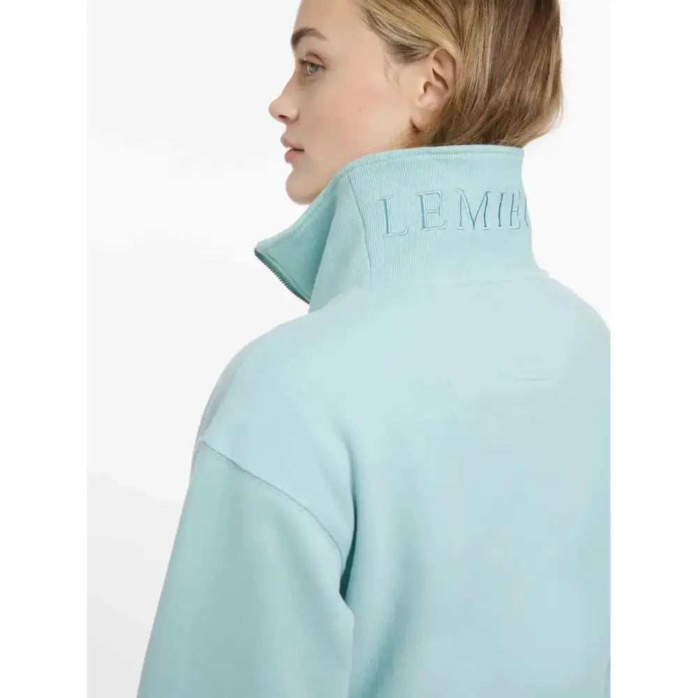 Light blue fleece lemieux keira quarter neck sweat with high collar and subtle embroidered branding