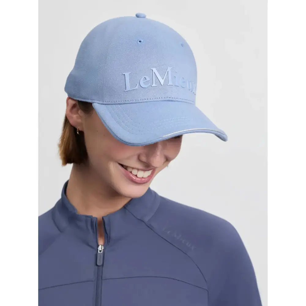 Light blue lemieux lara cap with embroidered branding cotton twill fabric and metal slide adjuster for a comfy fit