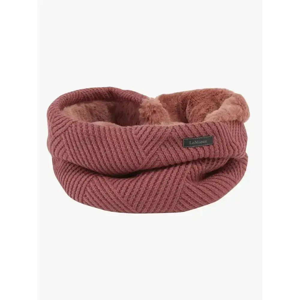 A cozy dusty rose lemieux layla snood with ultra-soft micro-fleece lining and a unique basket weave knit texture