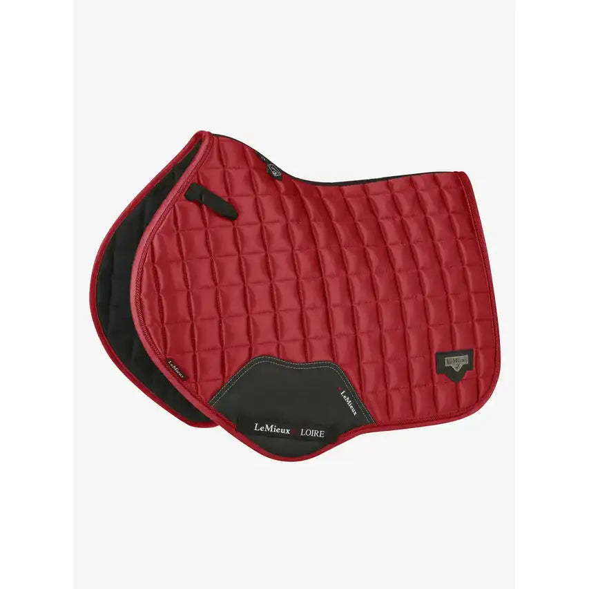 Red quilted lemieux loire classic close contact square chilli saddle pad with black accents and branded logo patch