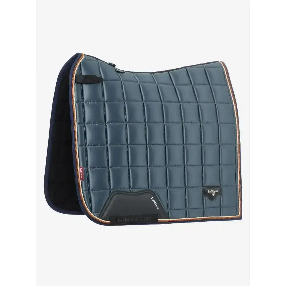 Dark blue quilted lemieux loire classic dressage square petrol saddle pad with gold trim and padded design for riding