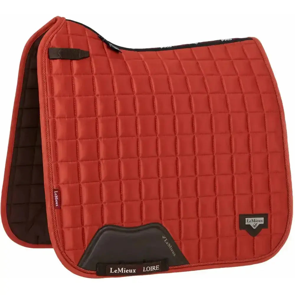 Red quilted lemieux loire classic satin dressage square saddle pad with black accents and lemieux loire label