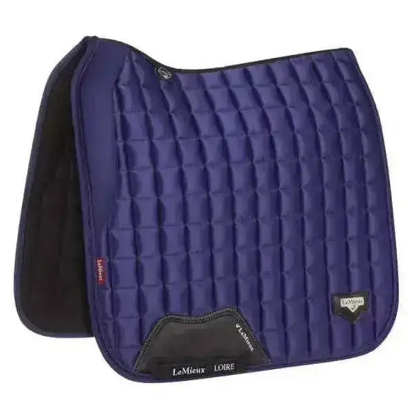 Deep navy blue quilted dressage square ink saddle pad with black leather accents and lemieux loire logo