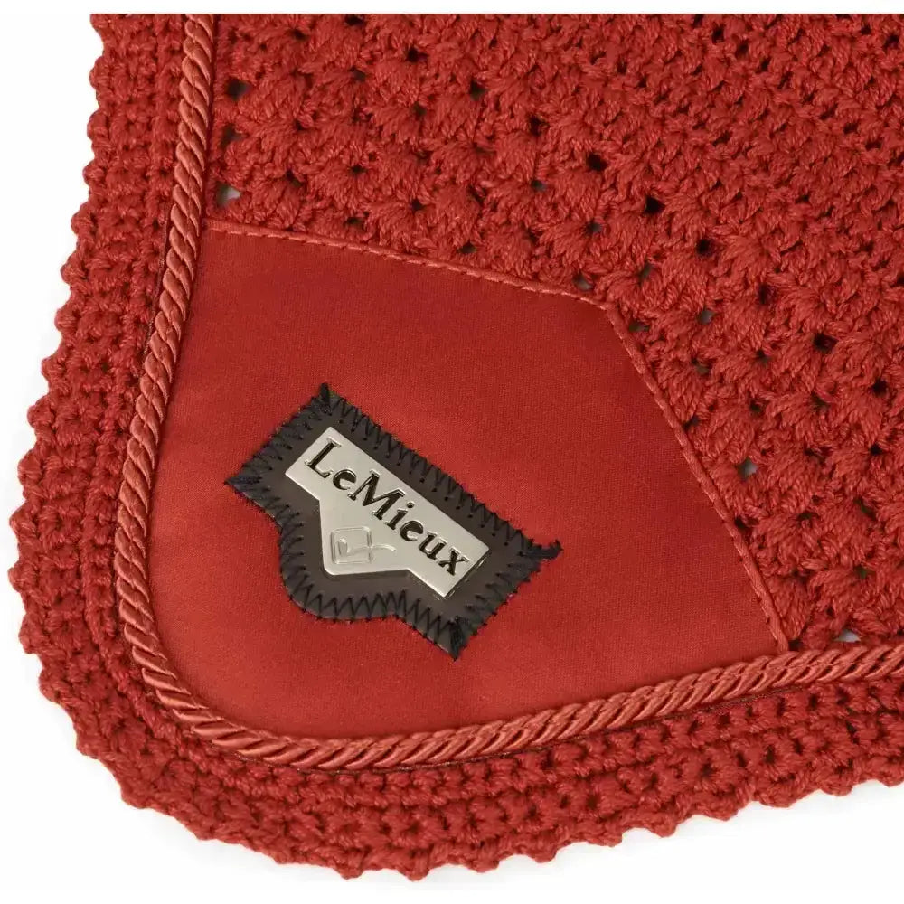 Red crocheted lemieux loire satin horse pad with suede patch and braided trim featuring signature lemieux loire label