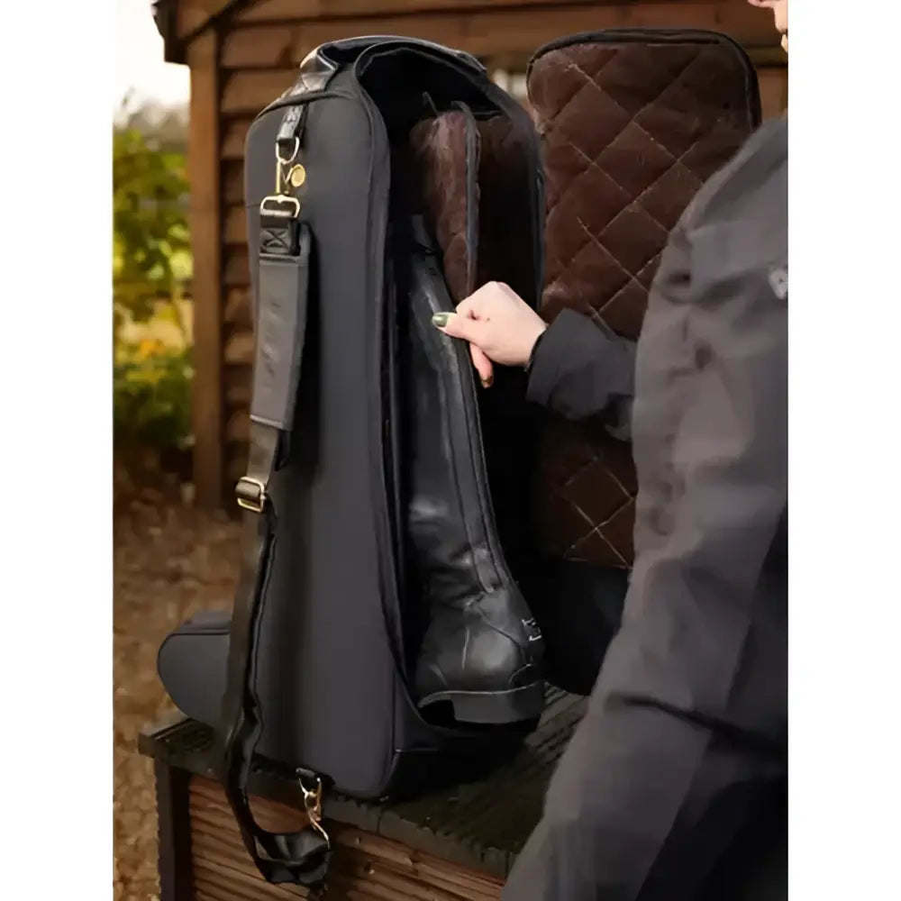 Black lemieux luxe boot bag with quilted design sturdy zipper adjustable strap and faux fur lining interior
