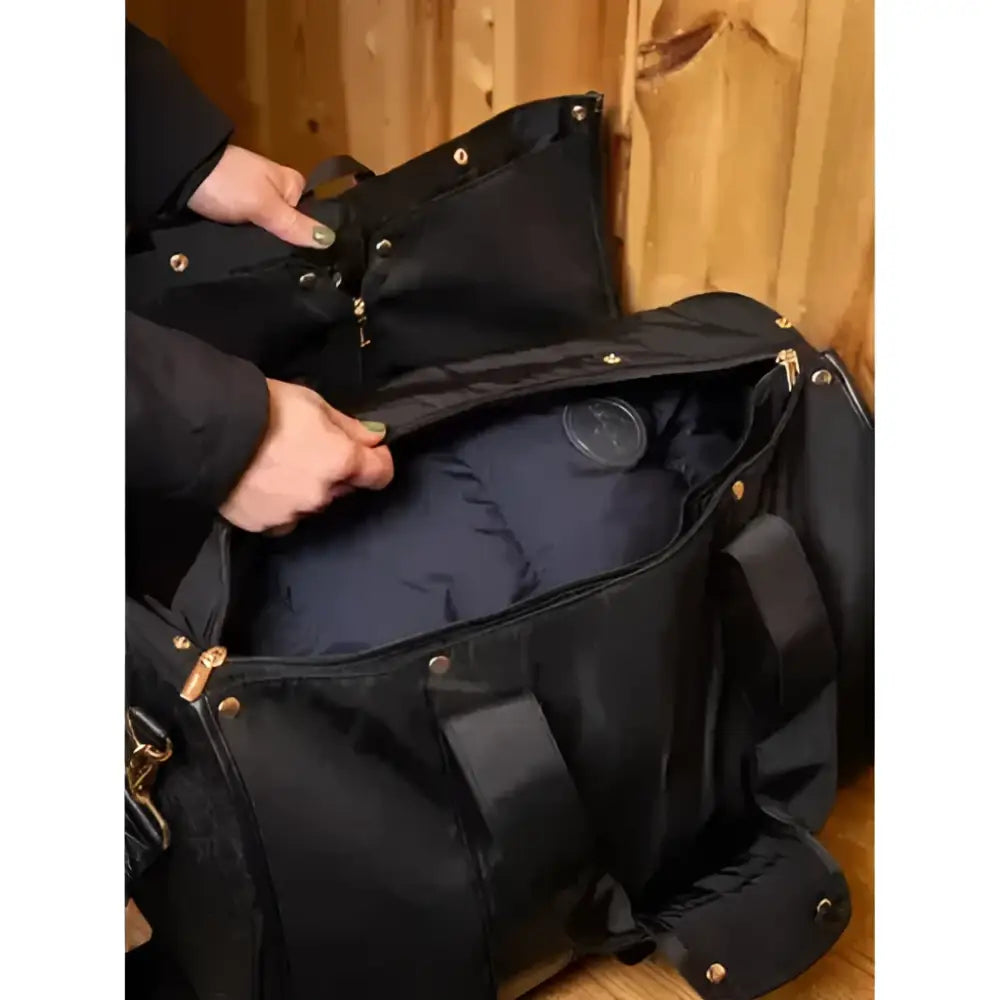 Black nylon lemieux luxe jacket duffle bag with gold zippers and metal grommets offers generous capacity