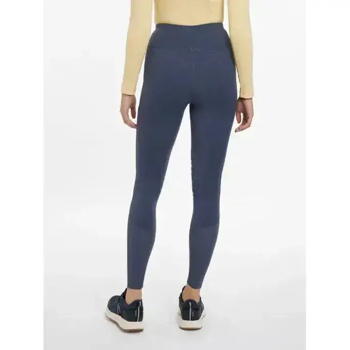 Dark blue high-waisted lemieux lydia mesh leggings made from smooth stretchy fabric in dusk blue color