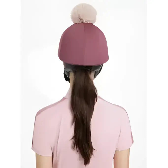 A soft mauve knit beanie with a fluffy beige pom pom from lemieux maria mesh hat silk rosewood collection