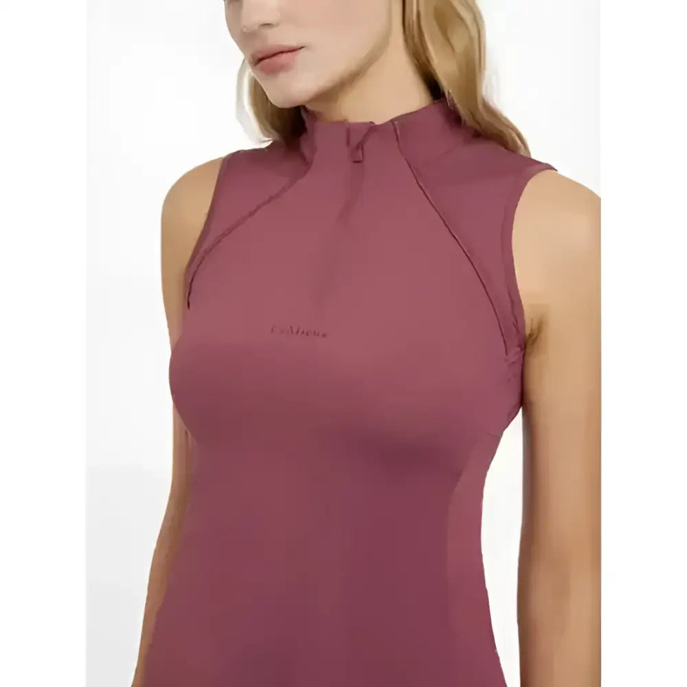 A mauve lemieux maria mesh sleeveless baselayer rosewood with high neck and subtle chest logo