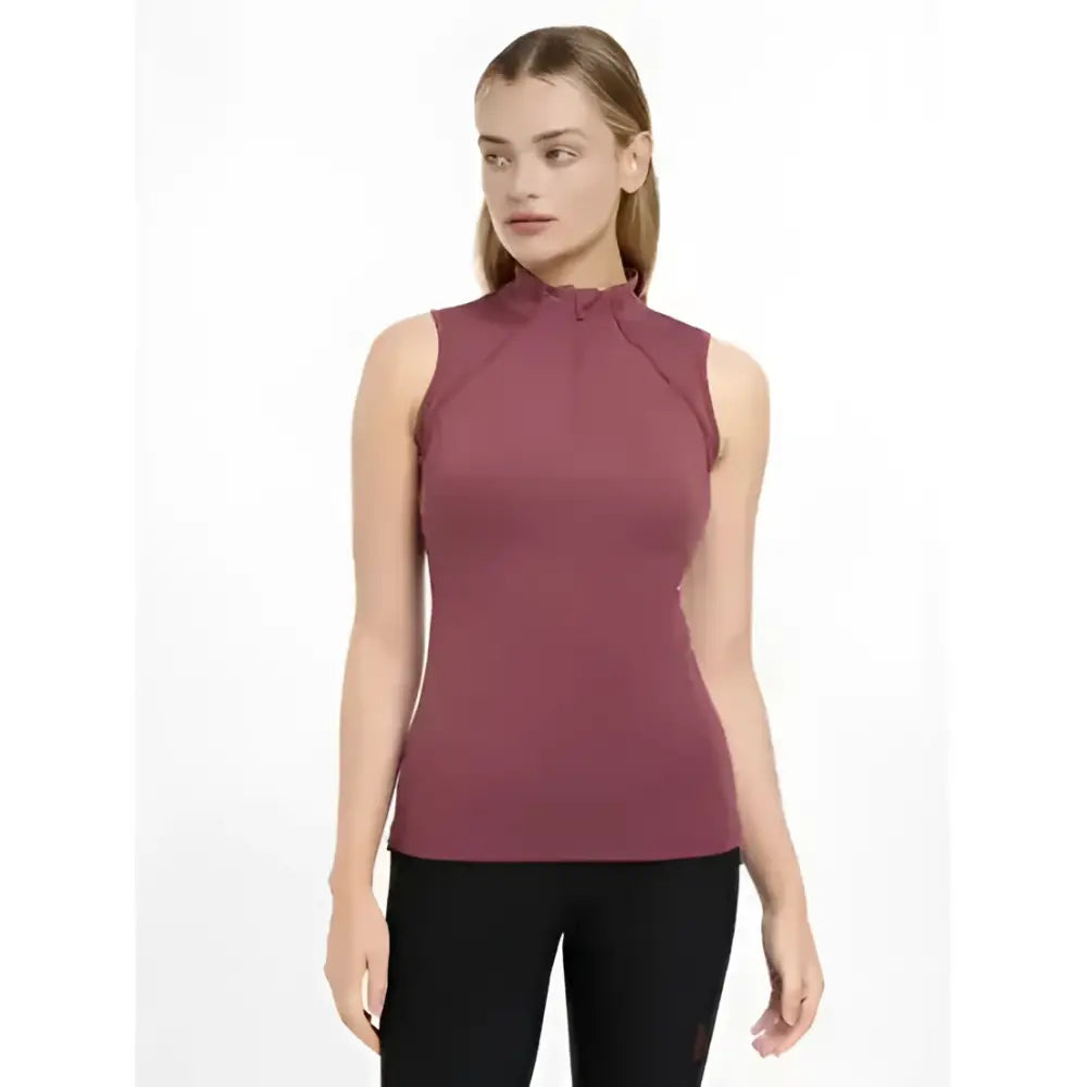 A fitted sleeveless baselayer in rosewood with high neckline and subtle ruching lemieux maria mesh sleeveless