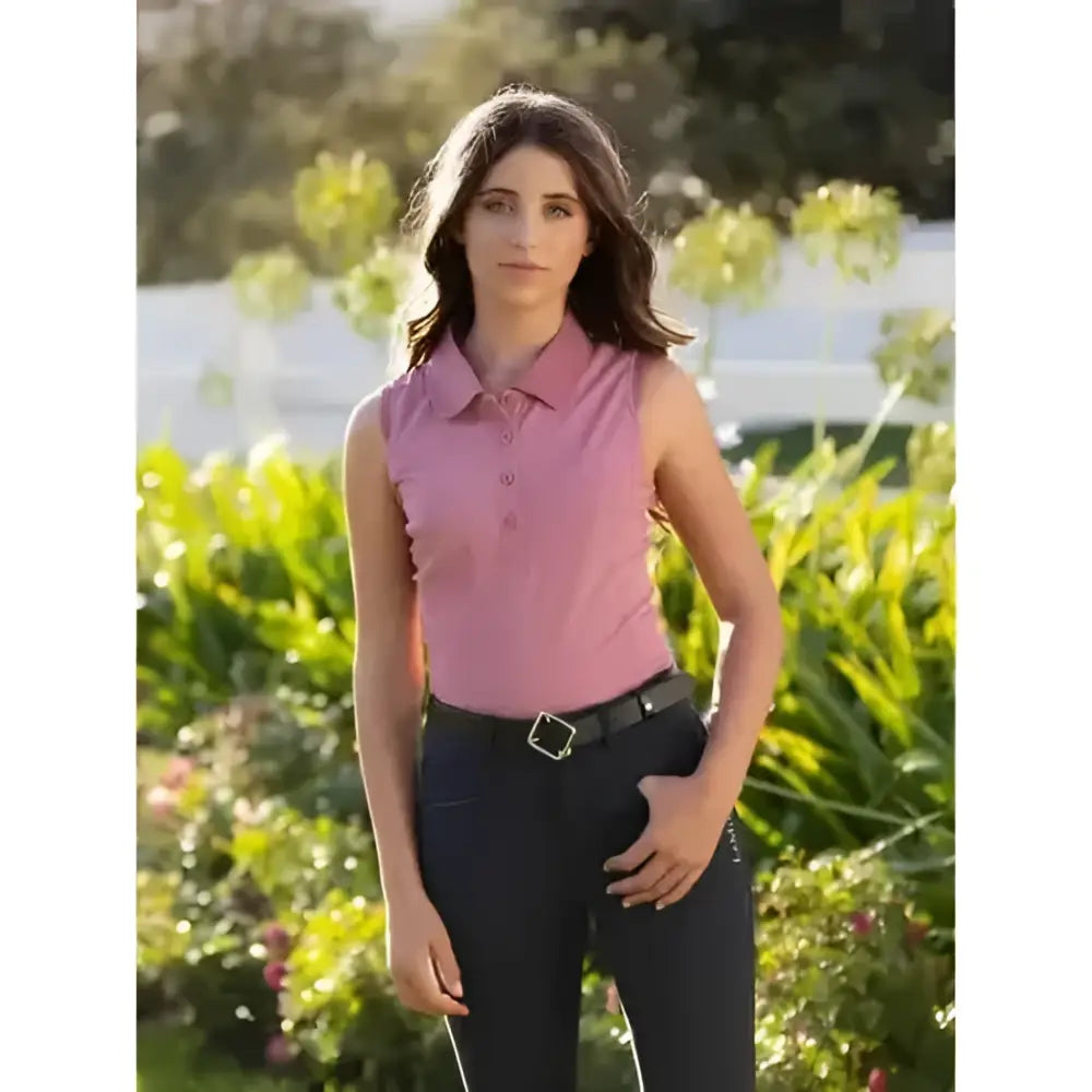 A sleeveless pink polo shirt with a collar and button front from lemieux marissa sleeveless polo peony collection