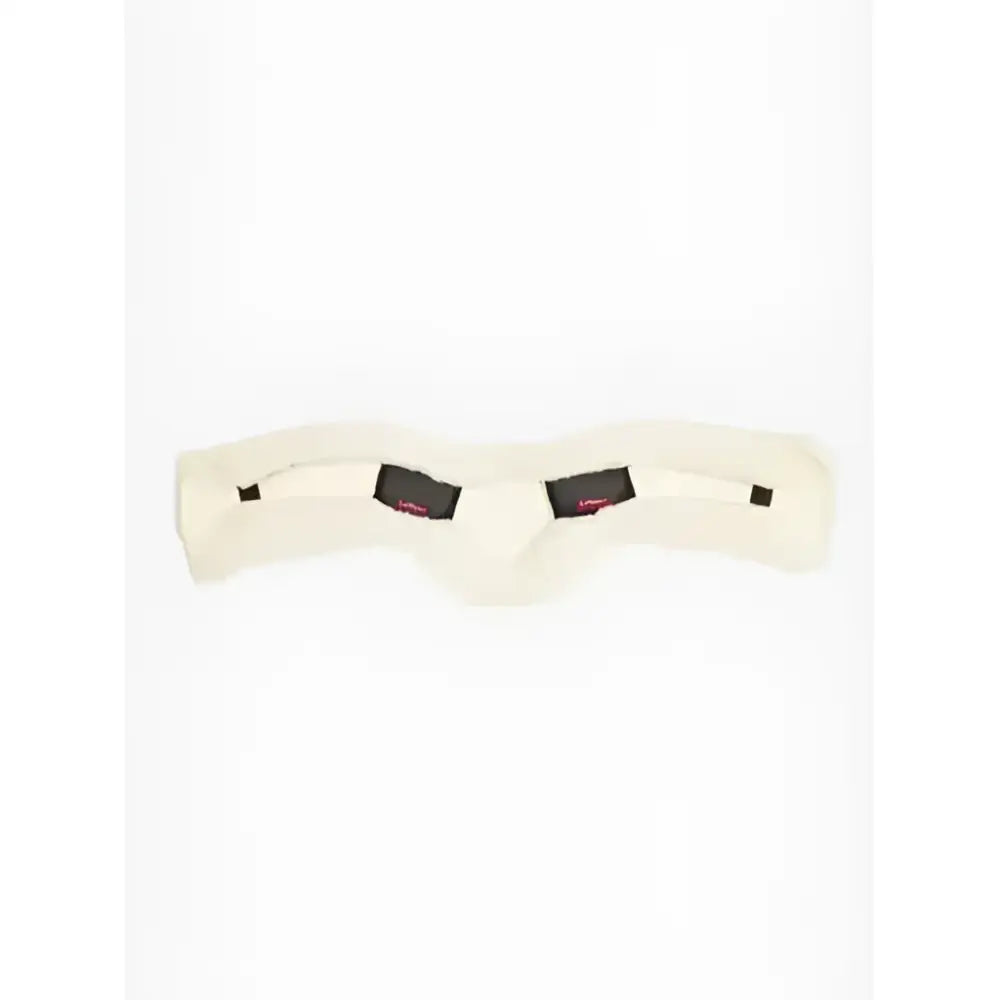 Cream-colored plush sheepskin anatomic dressage girth cover with black leather accents from lemieux natural collection
