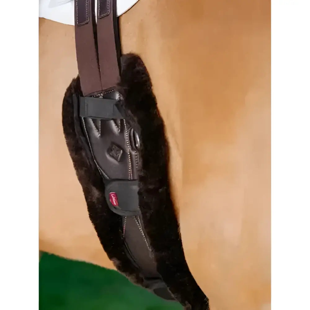 Black faux fur girth cover brown with padded leather straps and small red logo for anatomic jumping girth use