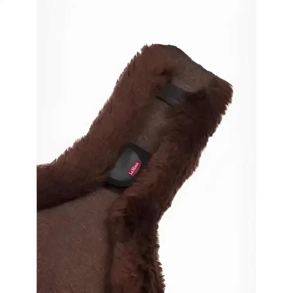 Brown plush merino anatomic long stud girth cover with black strap and pink logo tag for stud girth brown use