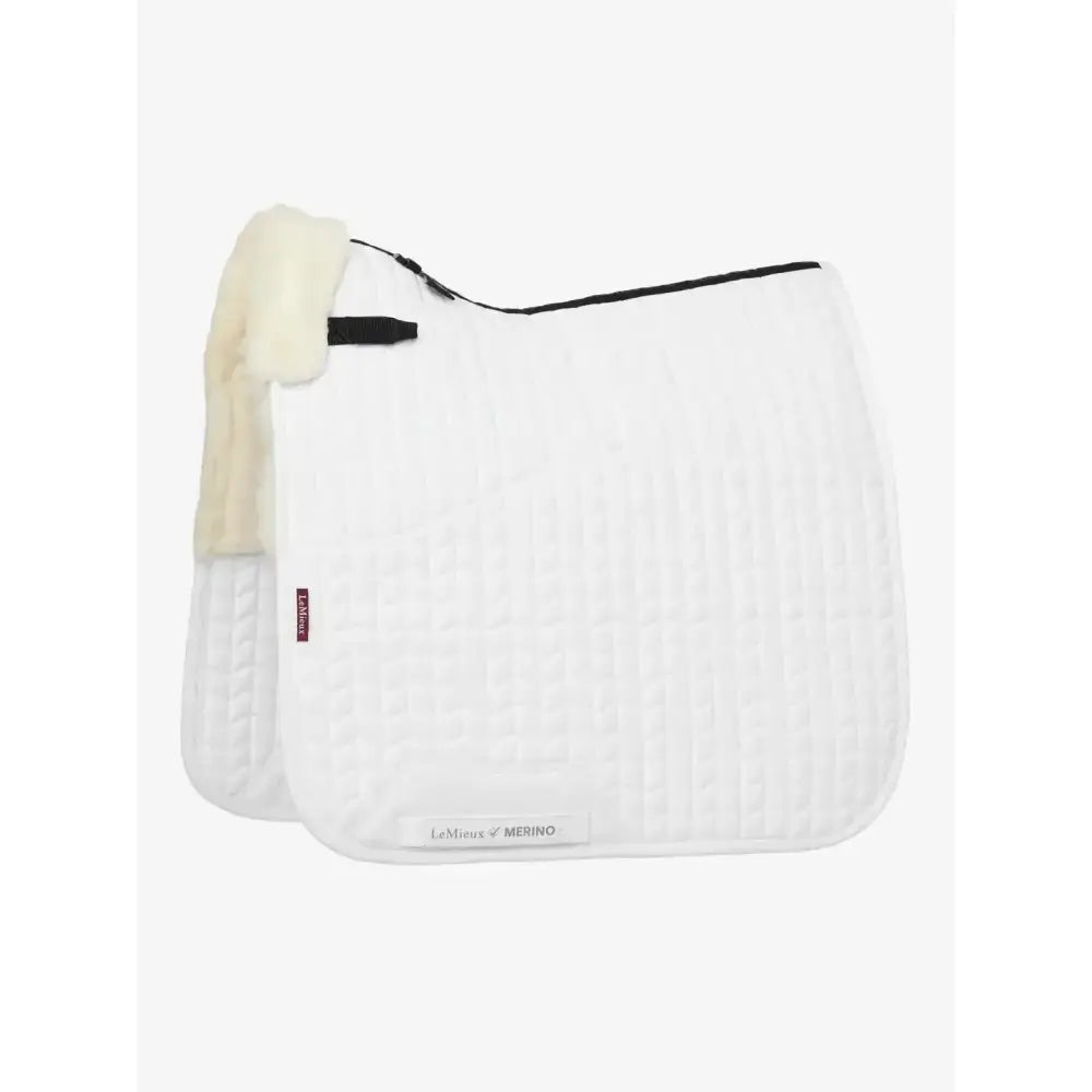 White lemieux merino+ half lined dressage square with cream fleece lining and black trim for dressage use