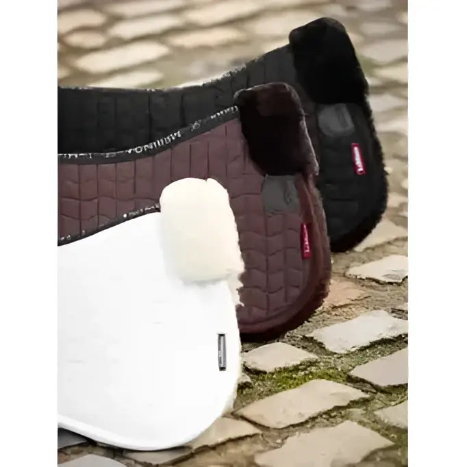 White and dark brown lemieux merino+ half pads with plush quilted surfaces made from natural australian merino