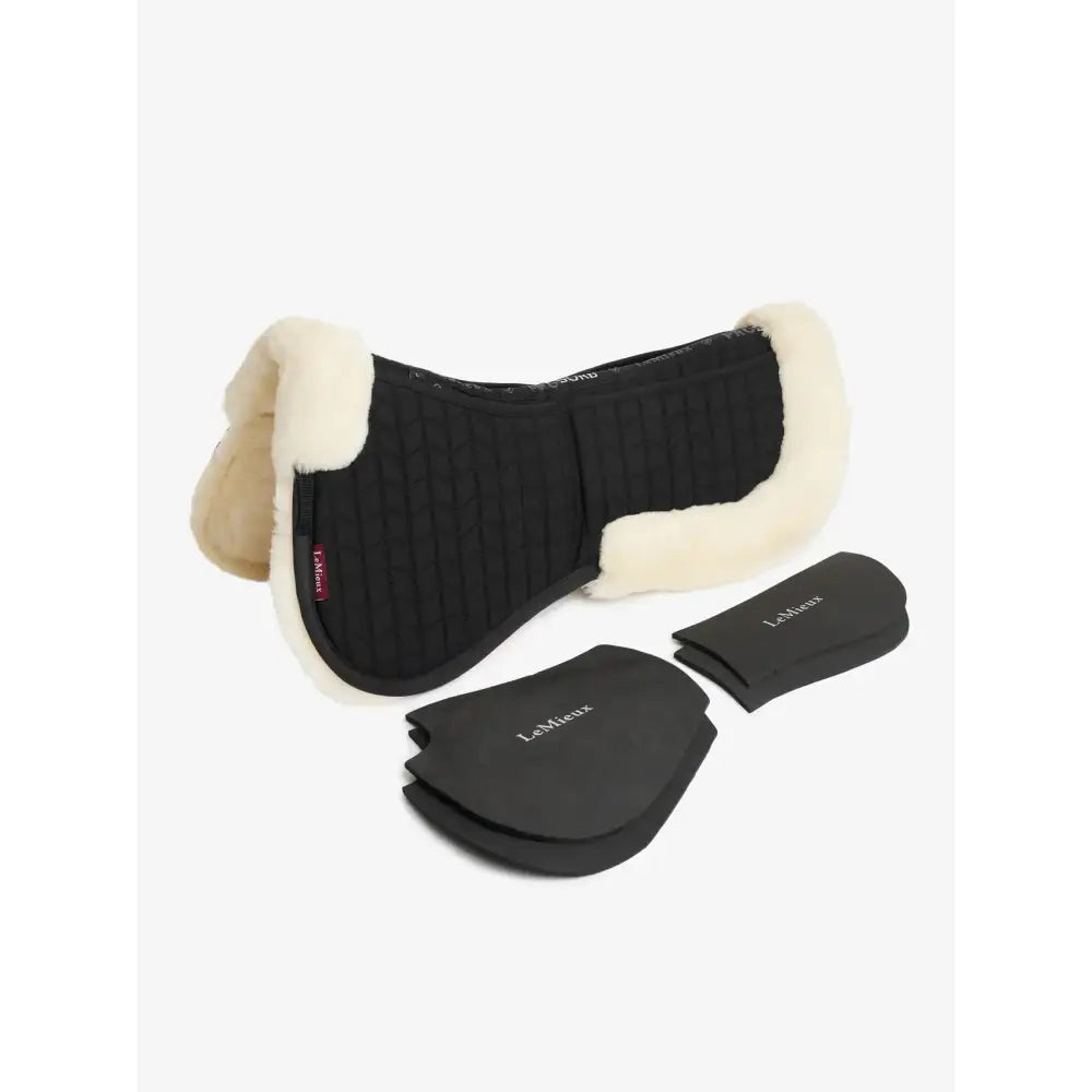 Black quilted lemieux merino+ prosorb pocket half pad with cream fleece trim and matching protective pads black natural