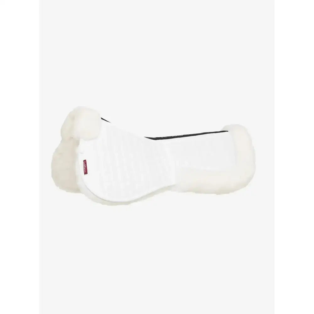 White sheepskin lemieux merino+ prosorb pocket half pad with black trim and red brand tag in white white color