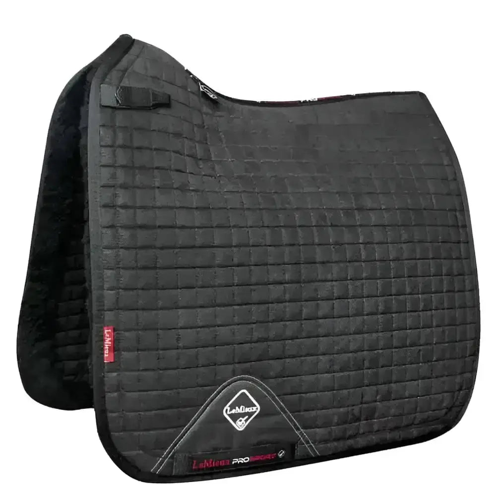 Black quilted lemieux merino+ sensitive dressage square black saddle pad with diamond logo and red branding details