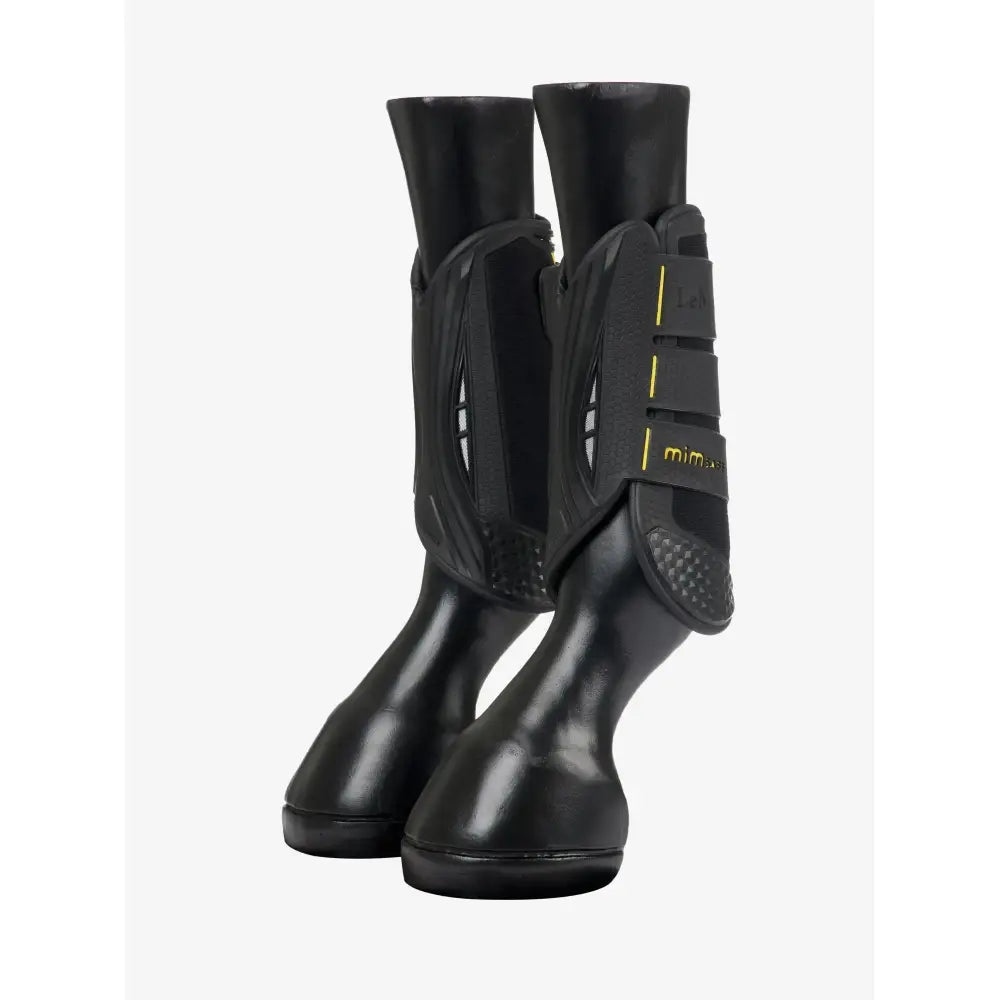 Black lemieux mimsafe xc boot front with yellow stitching and textured grip pad for leg protection in riding