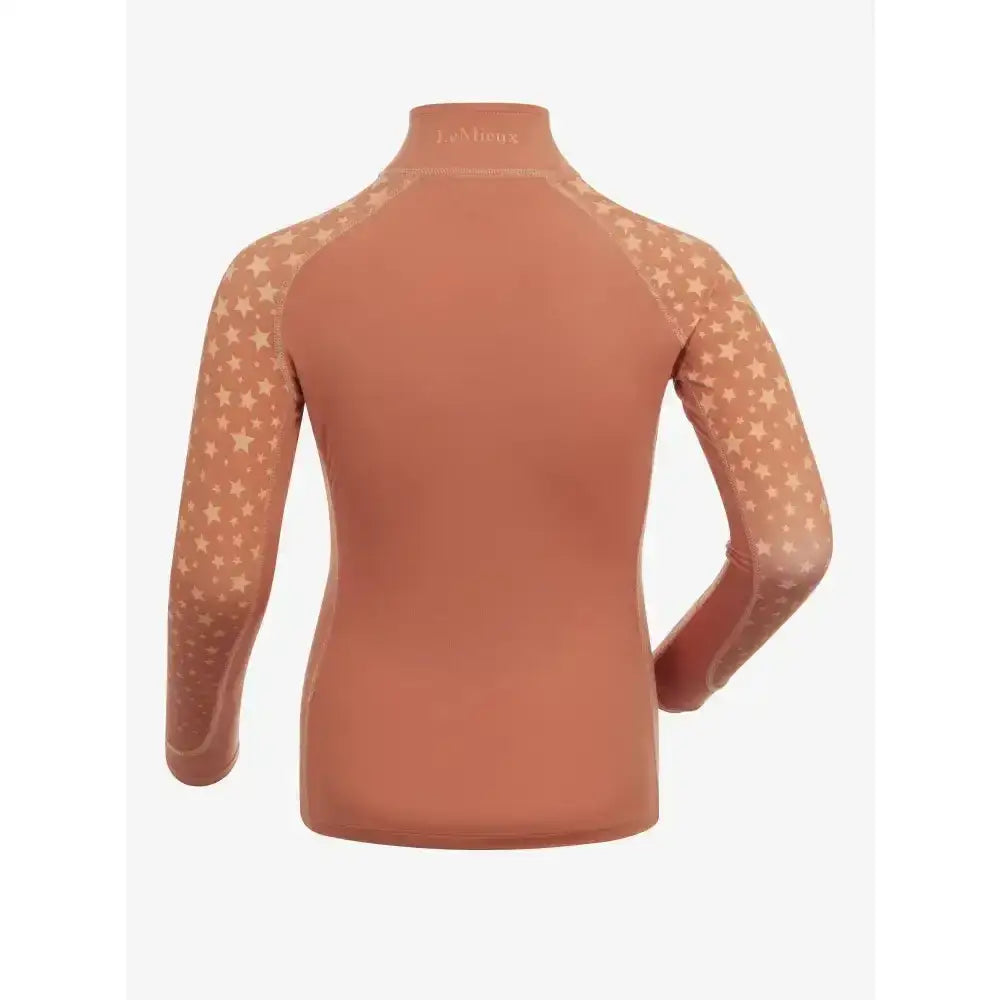 A terracotta lemieux mini base long-sleeved base layer apricot top with a high collar and ombre star print mesh sleeves