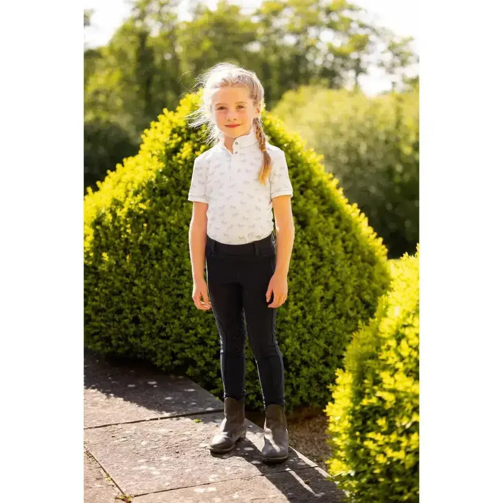 White short-sleeved lemieux mini bella polo shirt with subtle pattern perfect competition wear mini bella short style