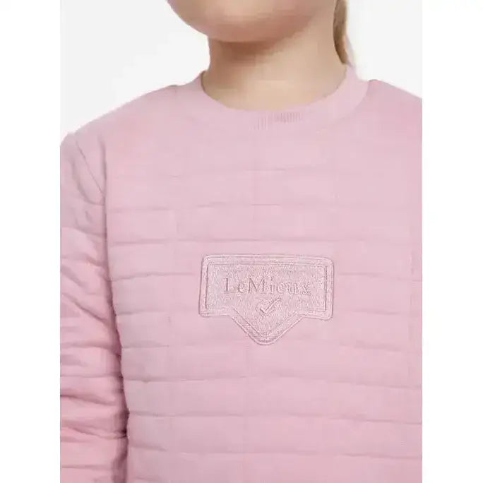 Pink quilted long sleeve lemieux mini cici crew top with subtle texture and embroidered lemieux logo patch on chest