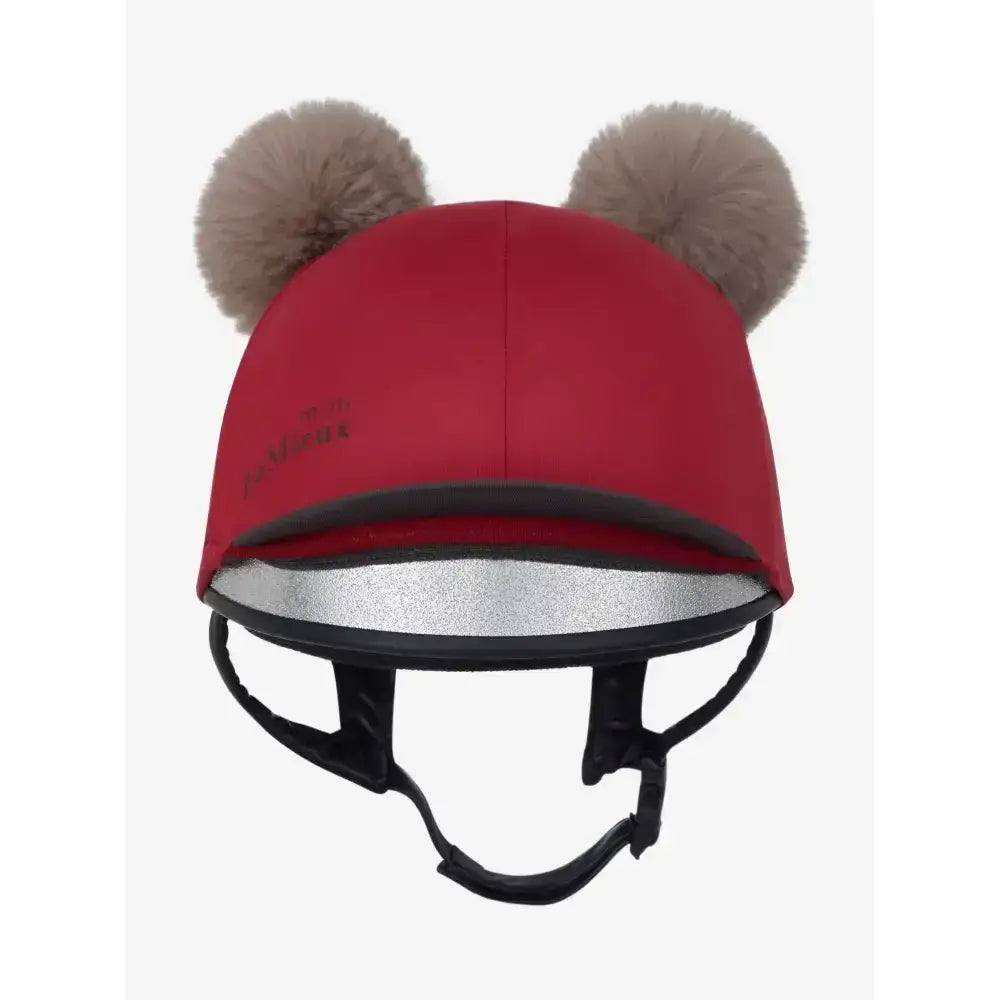 Red lemieux mini double pom hat silk ember with tan faux fur pom-poms and reflective silver lining on equestrian helmet cover