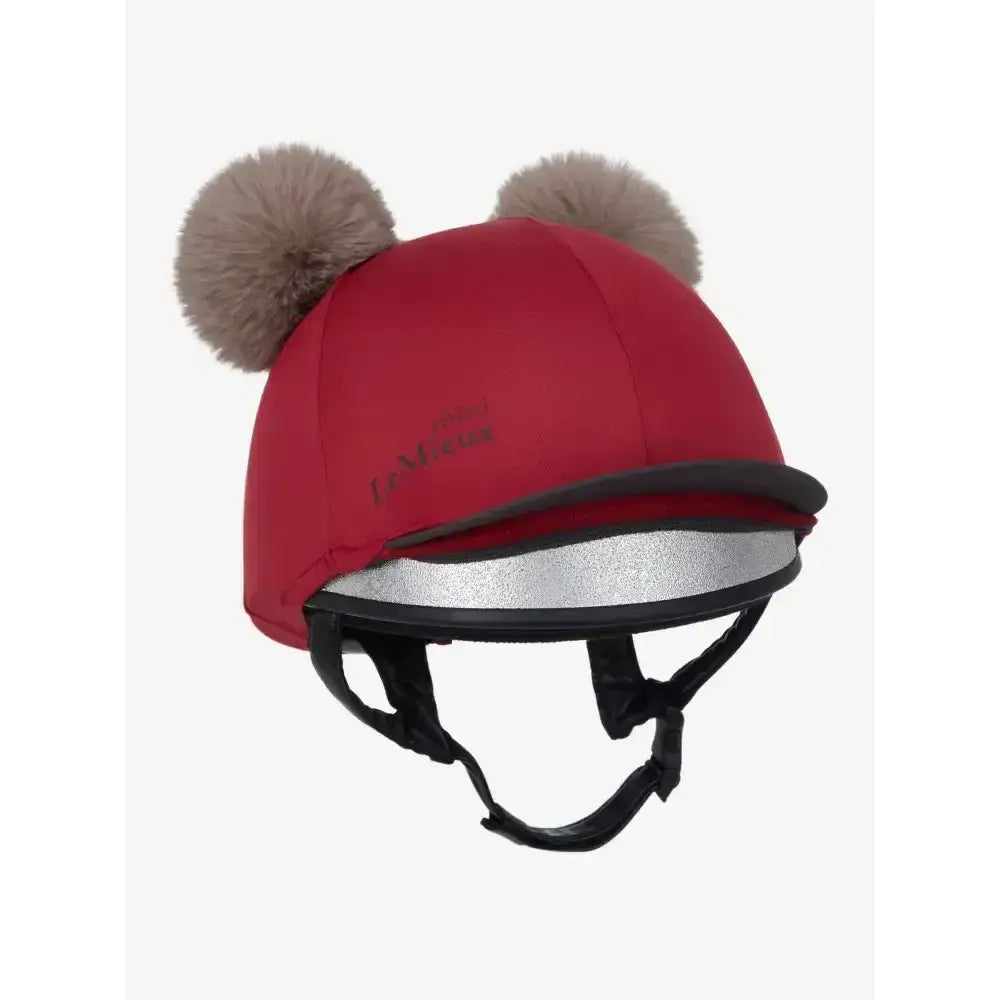 Red lemieux mini double pom hat silk ember with fuzzy beige pom-poms and reflective silver strip on the back