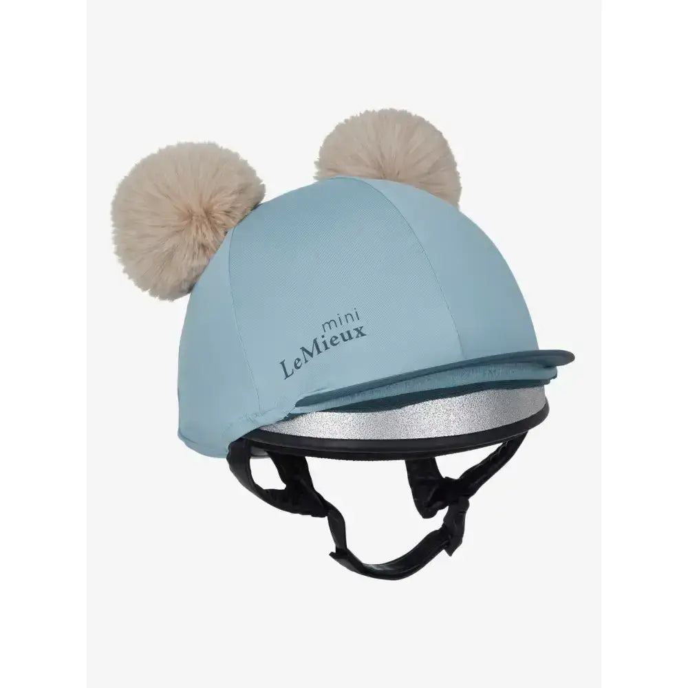 Light blue lemieux mini double pom hat silk glacier with beige double pom hat cover on top
