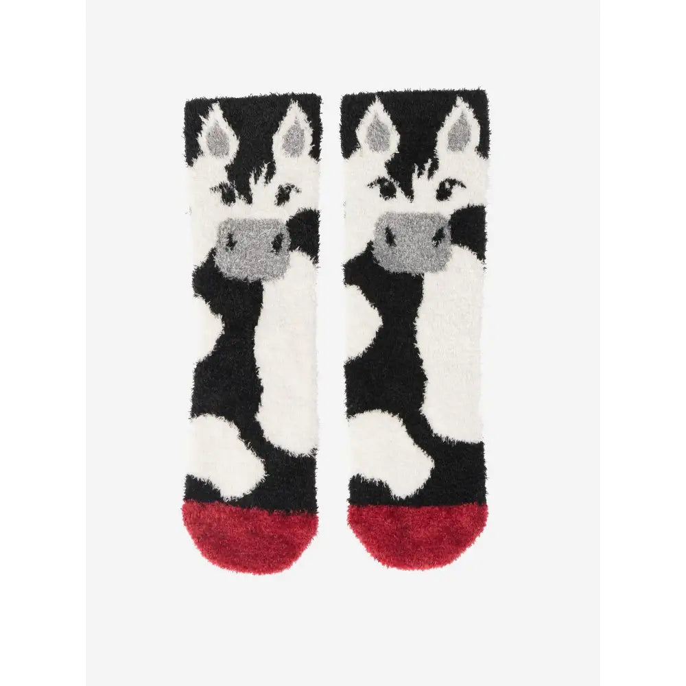 A pair of lemieux mini fluffy black and white zebra character socks razzle with gray accents and soft red toe caps