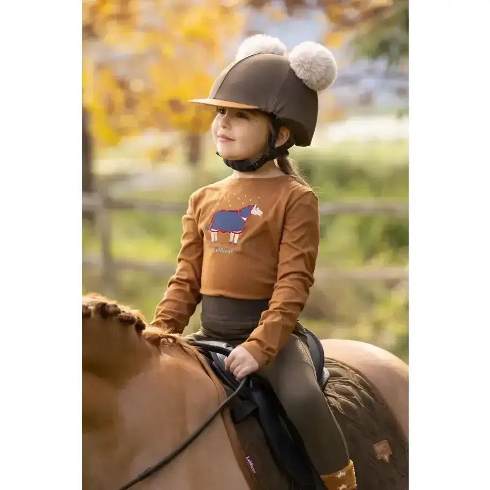 Brown lemieux mini jessie riding helmet with fluffy white pom-poms made of classic relaxed-fit long-sleeved nep fabric