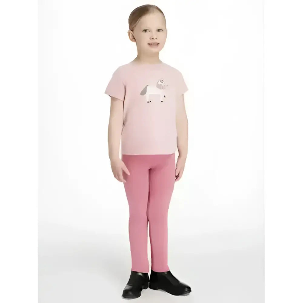 A soft pink short-sleeved t-shirt with a white and gray unicorn graphic perfect for pairing with lemieux mini legging sets