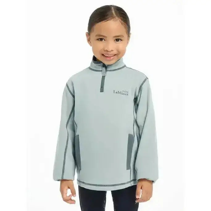 Light gray lemieux mini mari micro fleece glacier jacket with dark gray trim and half-zip front logo on chest