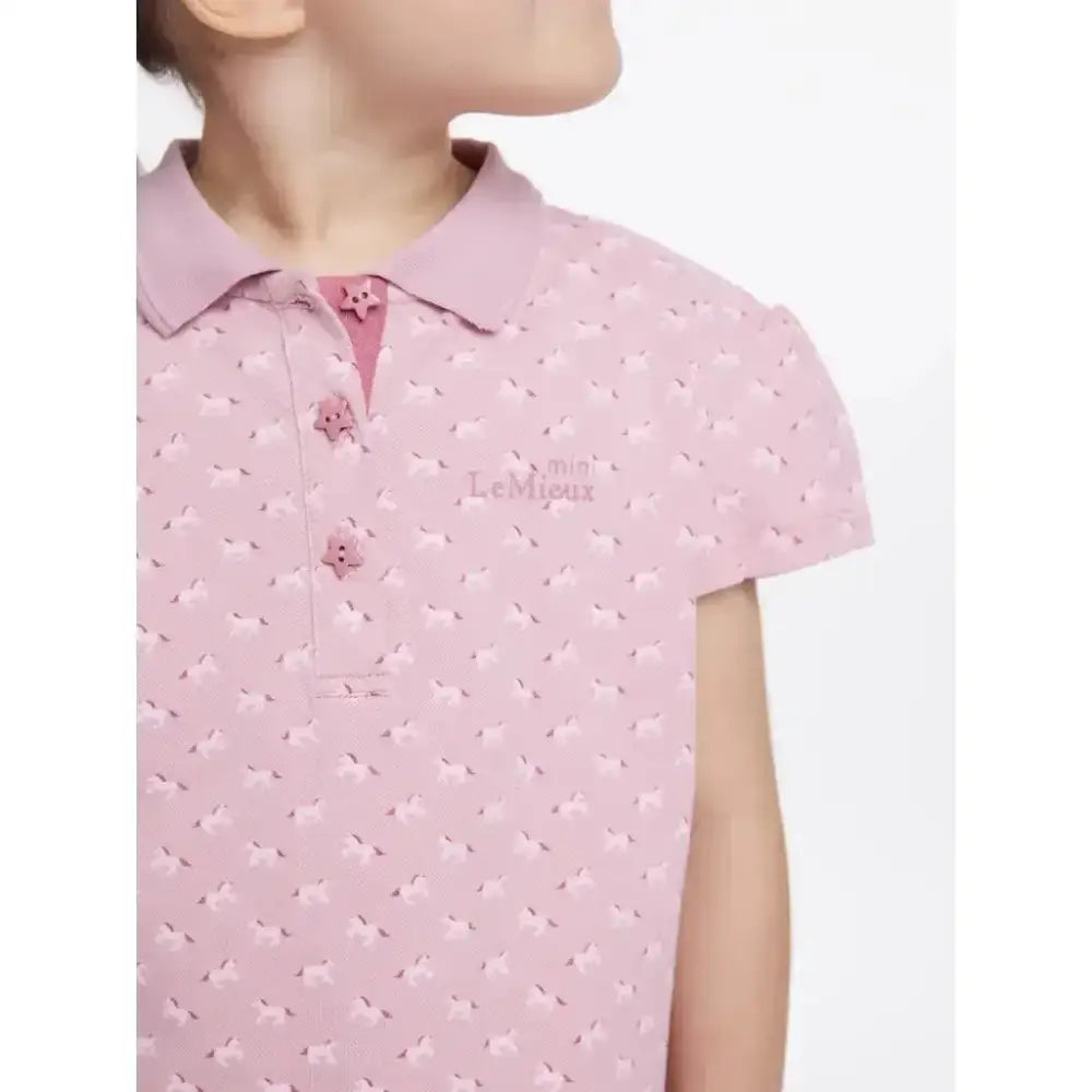Soft pink lemieux mini polo shirt blossom with tiny bow pattern star buttons and le mieux logo on chest