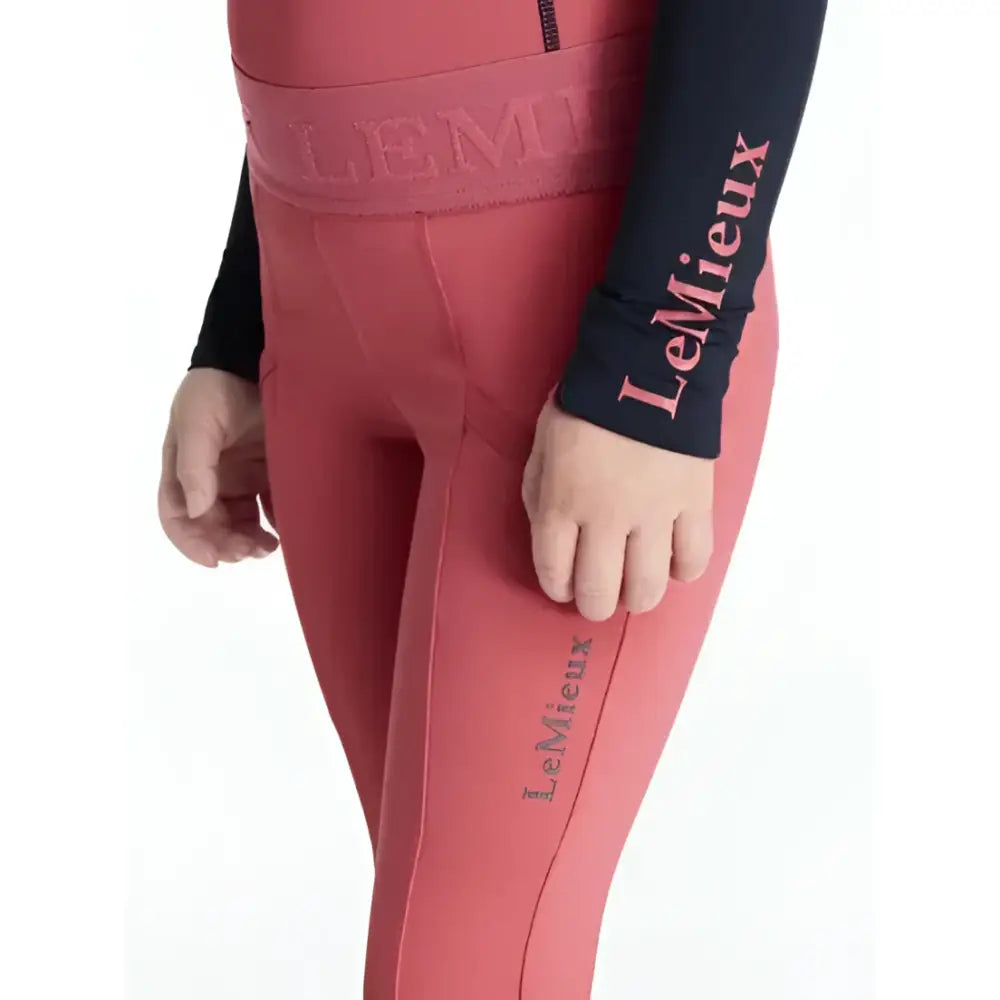 Pink lemieux mini pull on riders cranberry leggings with matching waistband and pink logo embroidery on leg paired with black long sleeve