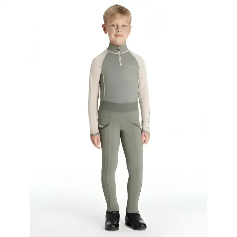 Gray and beige lemieux mini pull ons rosemary with high collar zippered front and functional pockets for mini riders