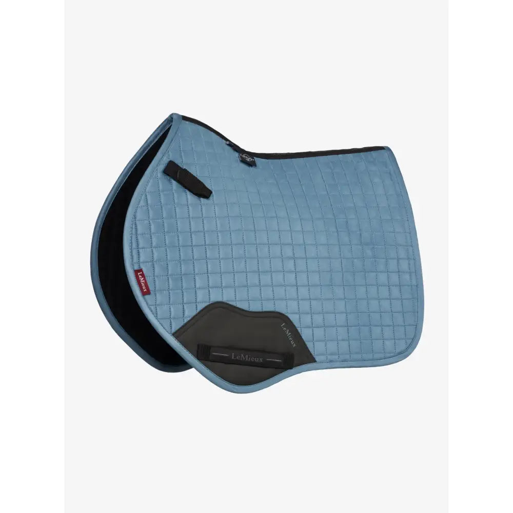 Light blue lemieux mini suede close contact square ice blue saddle pad with black trim and dark gray underside panel