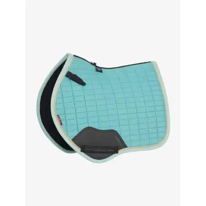Light blue lemieux mini suede close contact square saddle pad with gray black accents and branded logo lagoon color