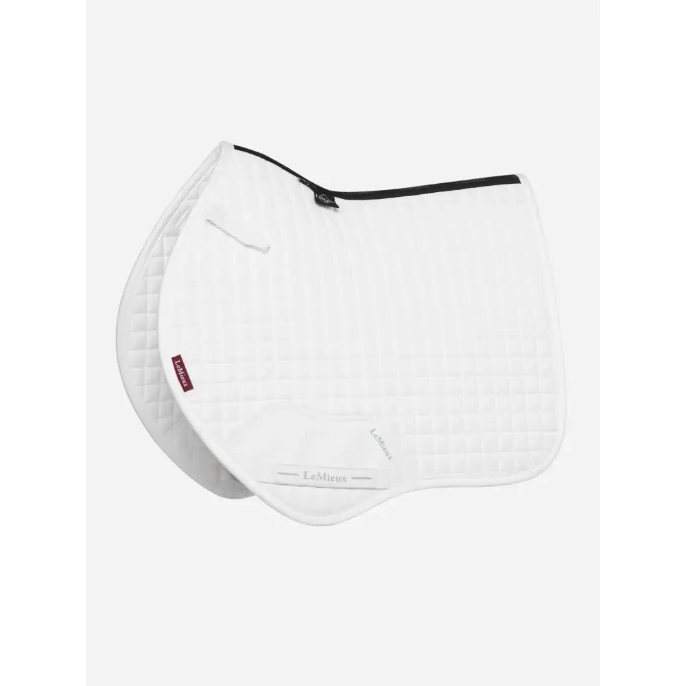 White quilted lemieux mini suede close contact square saddle pad with black trim and red brand tag