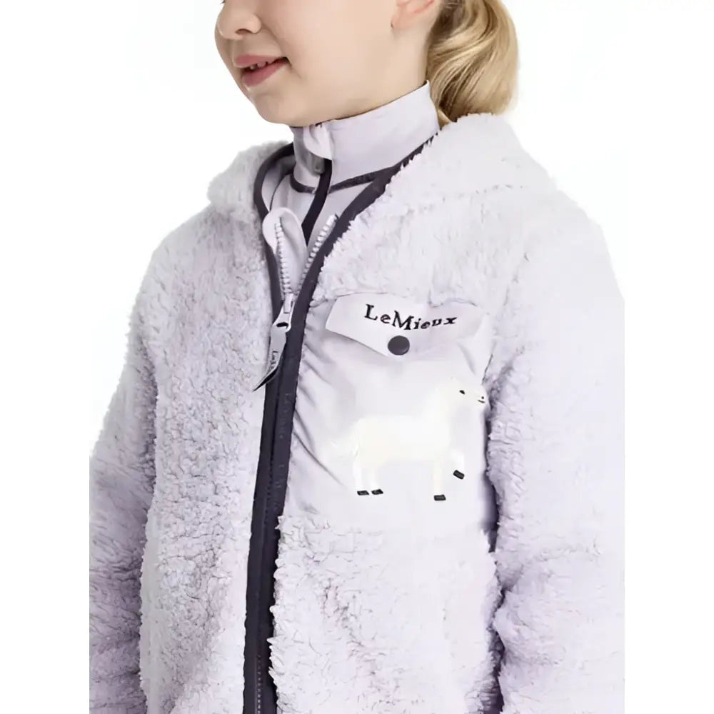 Light purple fluffy lemieux mini teagan lemon fleece jacket with black zipper and white patch pocket lemon fleece lilac