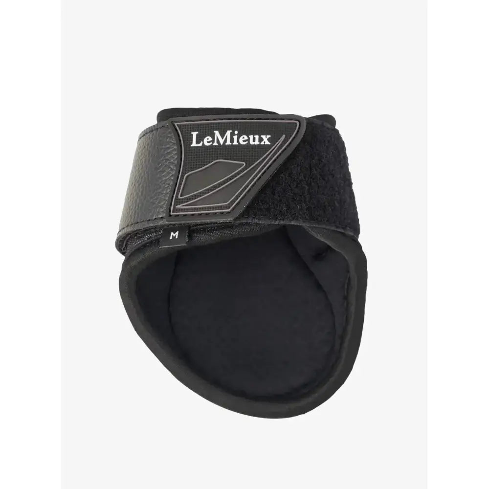 Black lemieux motion cool fetlock boot with textured leather strap and padded interior for flexible lightweight protection