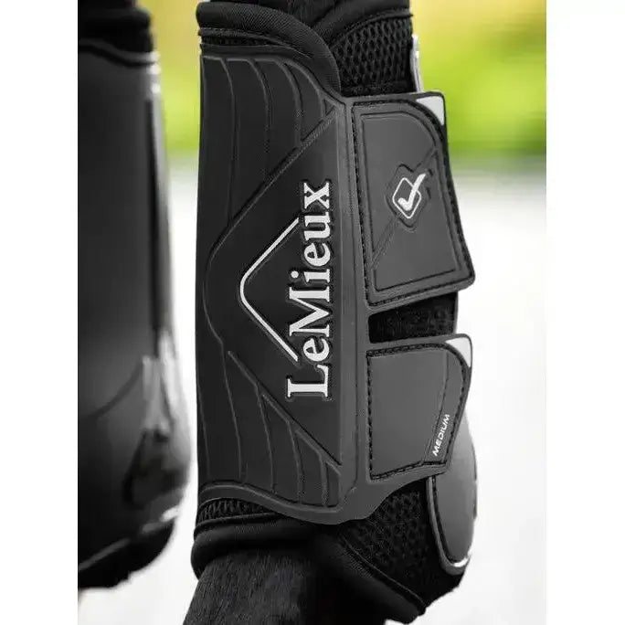 Black lemieux motionflex dressage boot with sleek textured design and adjustable straps for flexible motionflex dressage