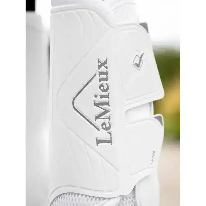 White lemieux motionflex dressage boot guard with sleek molded design and subtle gray logo detailing for flexible motionflex dressage
