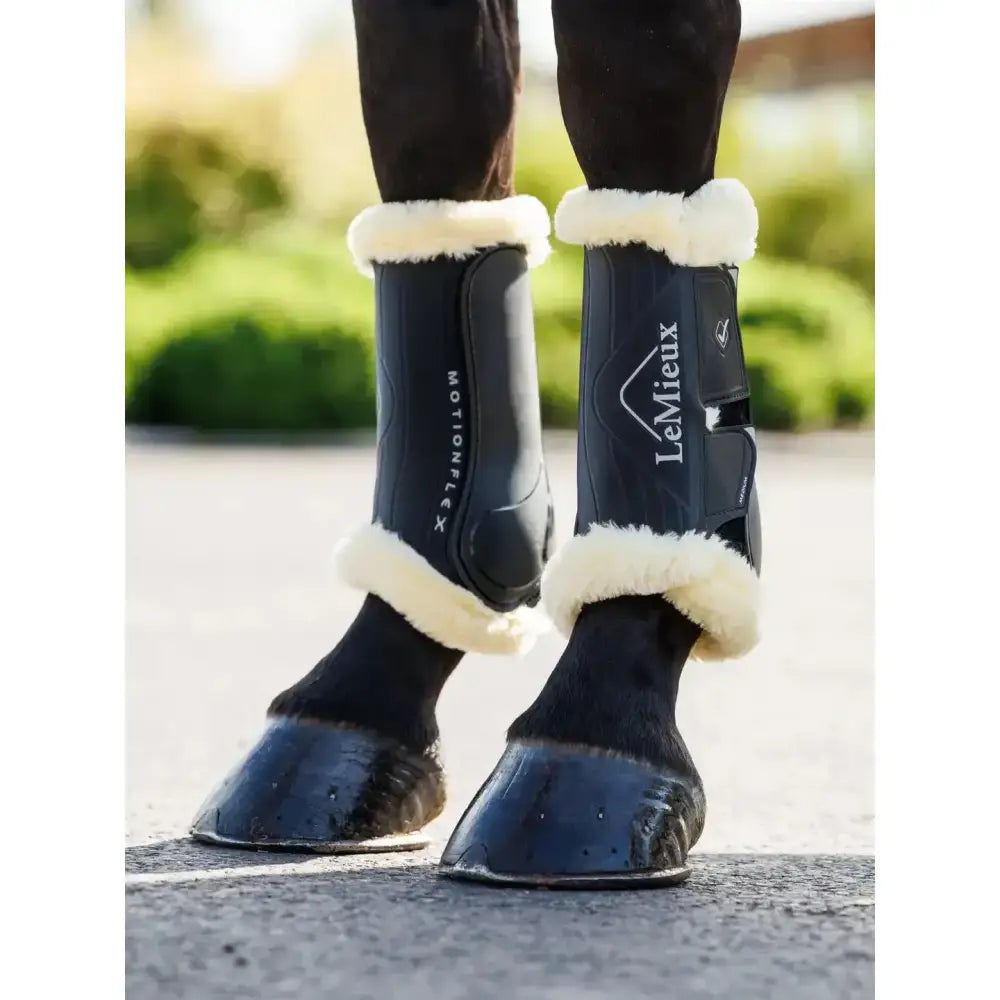 Black lemieux motionflex dressage boot with fleece edge black natural features white fleece trim for schooling use