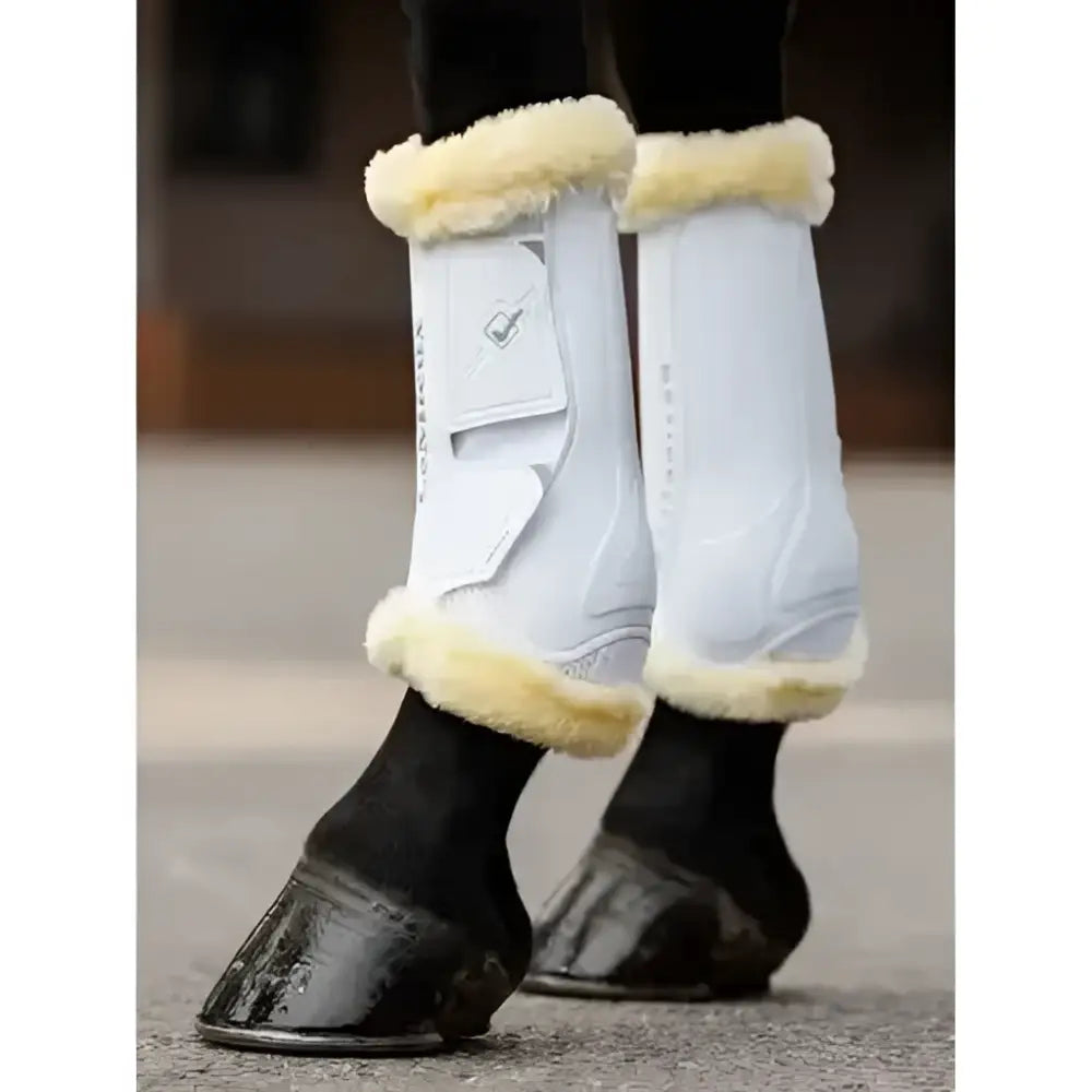 White lemieux motionflex dressage boot with cream fleece trim and branded logo patch designed for rigid schooling boots use
