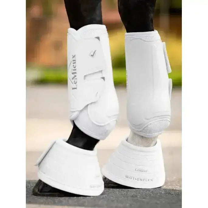 White lemieux motionflex reach boots with sleek padded design and adjustable straps for optimal leg protection