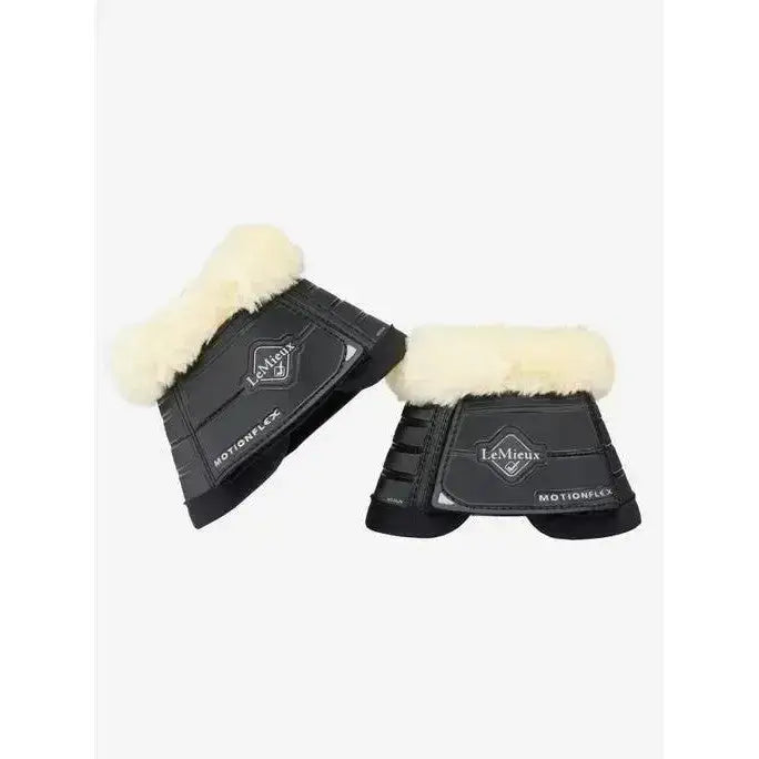 Black lemieux motionflex reach boots with cream fleece edge black lining for horse leg protection