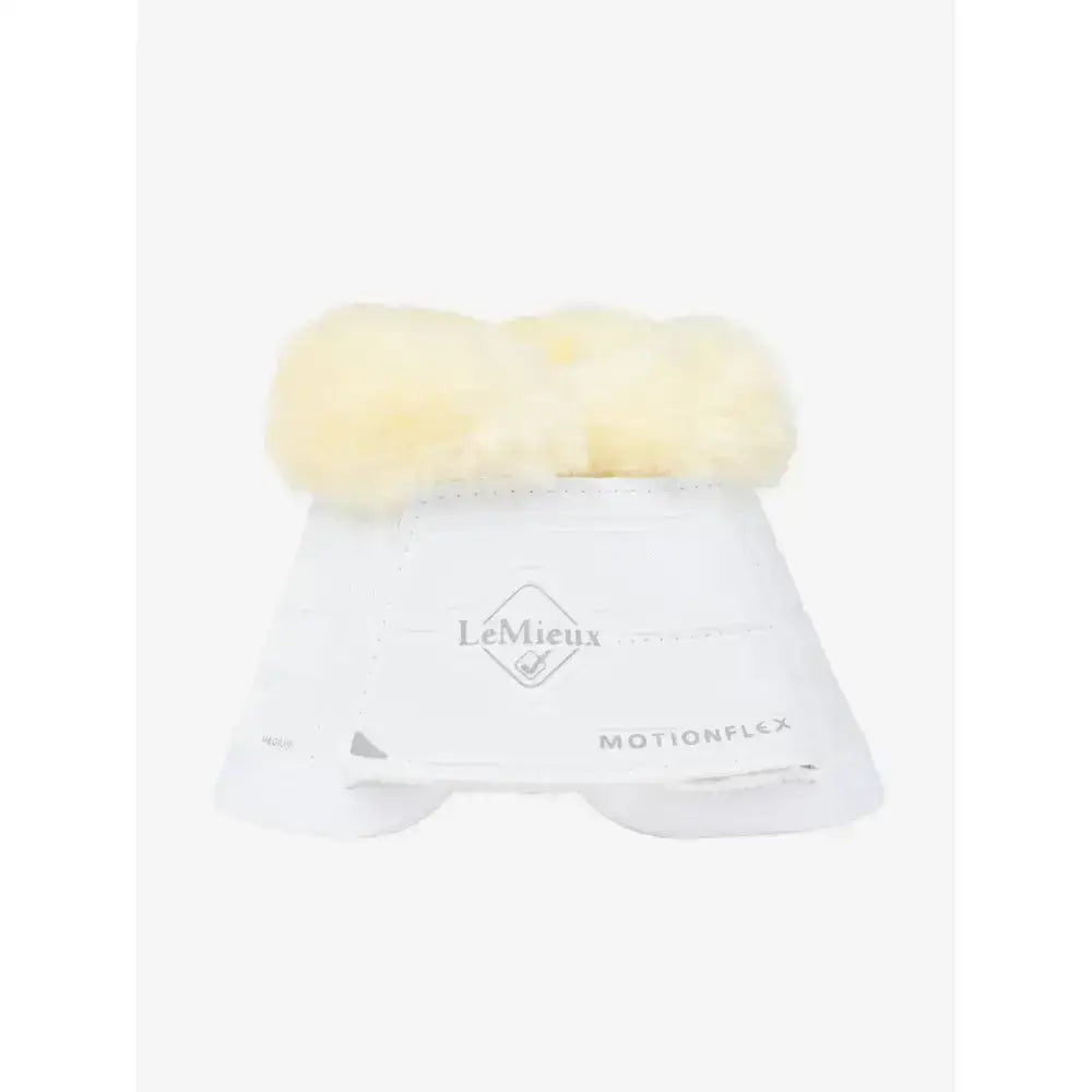 White lemieux motionflex reach boot with a strong lightweight shell and pale yellow fleece edge trim