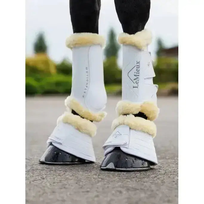 White lemieux motionflex reach boots with cream fleece edge strong lightweight shell for equine protection